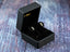 Eternal Spark 18K Gold Infinity CZ Earrings in black jewelry box showcasing spark 18K gold elegance