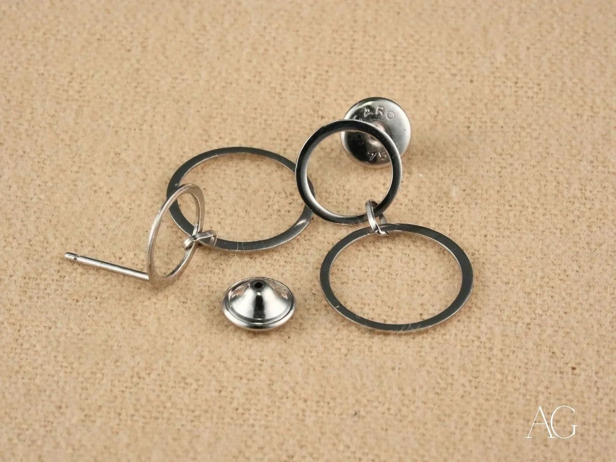 Disassembled components of Ethereal Circles 18K white gold dangle earrings