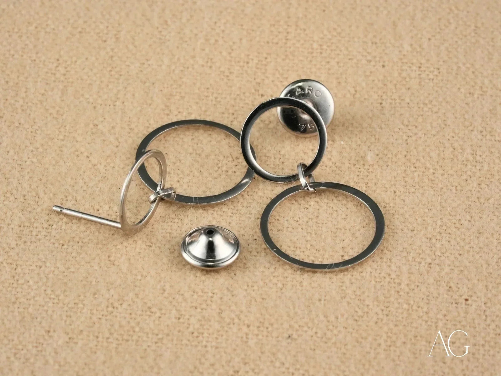 Disassembled components of Ethereal Circles 18K white gold dangle earrings