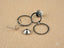 Disassembled silver-colored ethereal circles white gold dangle earring showcasing art gold jewelry craftsmanship