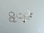 Silver-toned hoop earrings with stud backs from Ethereal Circles white gold dangle jewelry collection