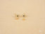 Gold evil eye stud earrings with white and black stones, part of art gold jewelry collection