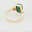 Gold ring with a rectangular emerald gemstone showcasing a rare emerald encounter in Greater Boston Area