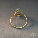 Exquisite blue topaz gold ring with pear-shaped gemstone