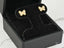 Butterfly earrings showcasing fluttering elegance with gold CZ butterfly design in a black velvet box