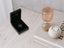 Open black velvet jewelry box with 18k solid gold double heart pendant from Forever Together collection