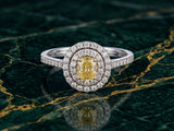 Front view of double halo engagement ring with yellow diamond center and diamond encrusted shoulders
