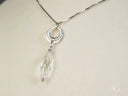 Frost Glow 18k white gold necklace with interlocking rings and crystal drop