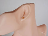 Certified 18k solid gold geometric diamond earring on ear mannequin