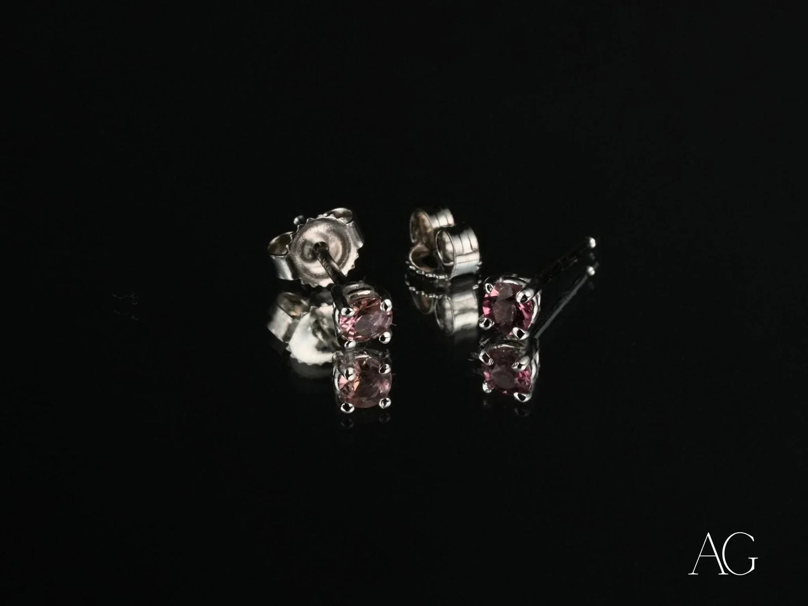 Pair of white gold tourmaline earrings with purple gemstones