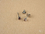 Pair of white gold tourmaline earrings with pinkish-purple gems