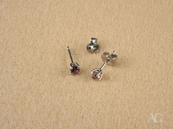 Pair of white gold tourmaline earrings with pinkish-purple gems