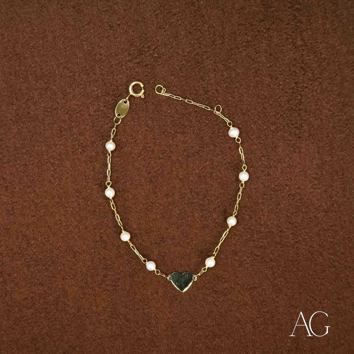 Elegant 18k gold heart and pearl bracelet