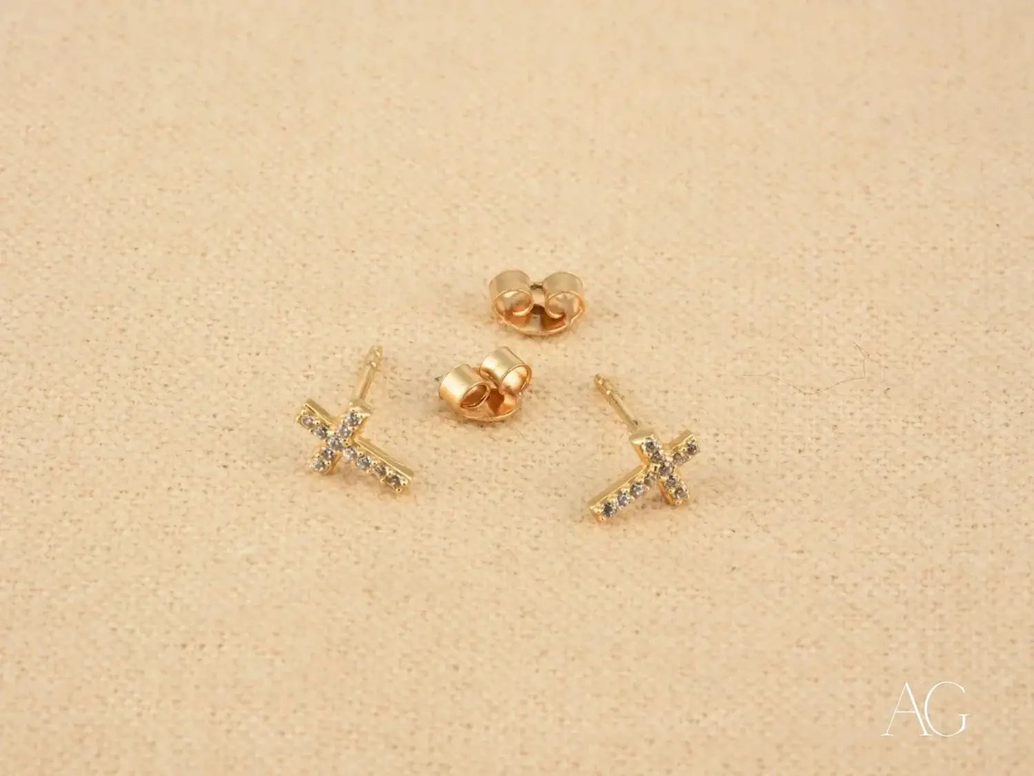 gold cross stud earrings featuring sparkling clear crystals crafted in 18k gold, highlighting elegant art gold jewelry styles before visiting Everett Jewelry store.