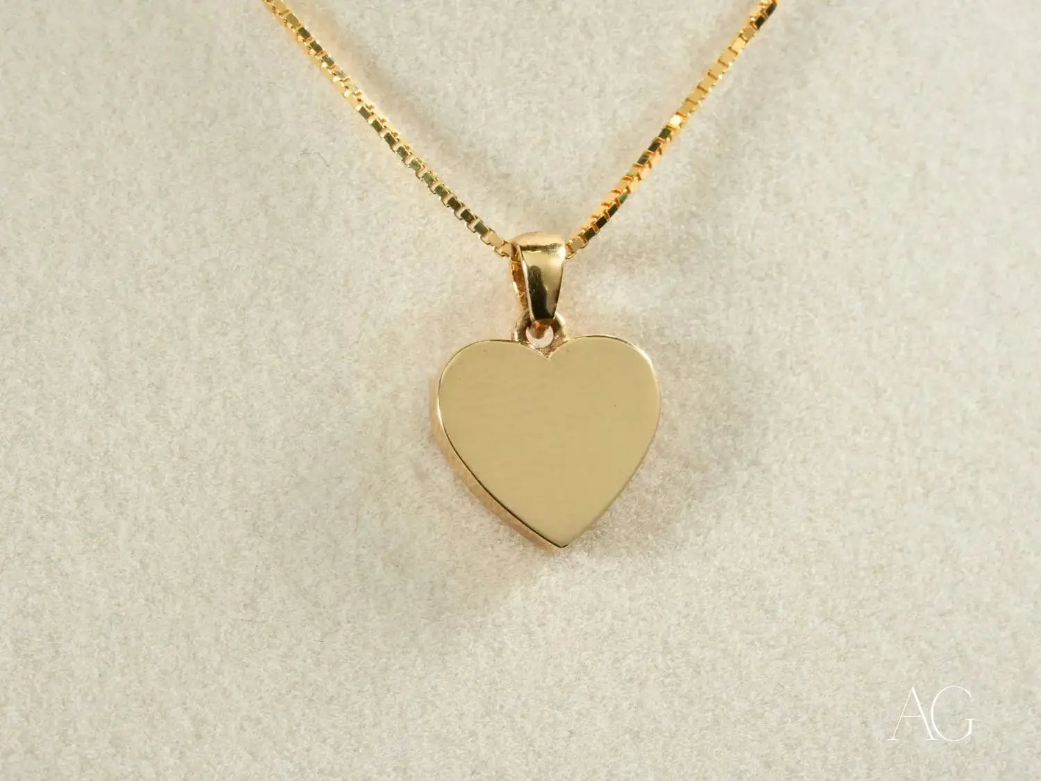 Gold heart-shaped pendant on luxury jewelry chain