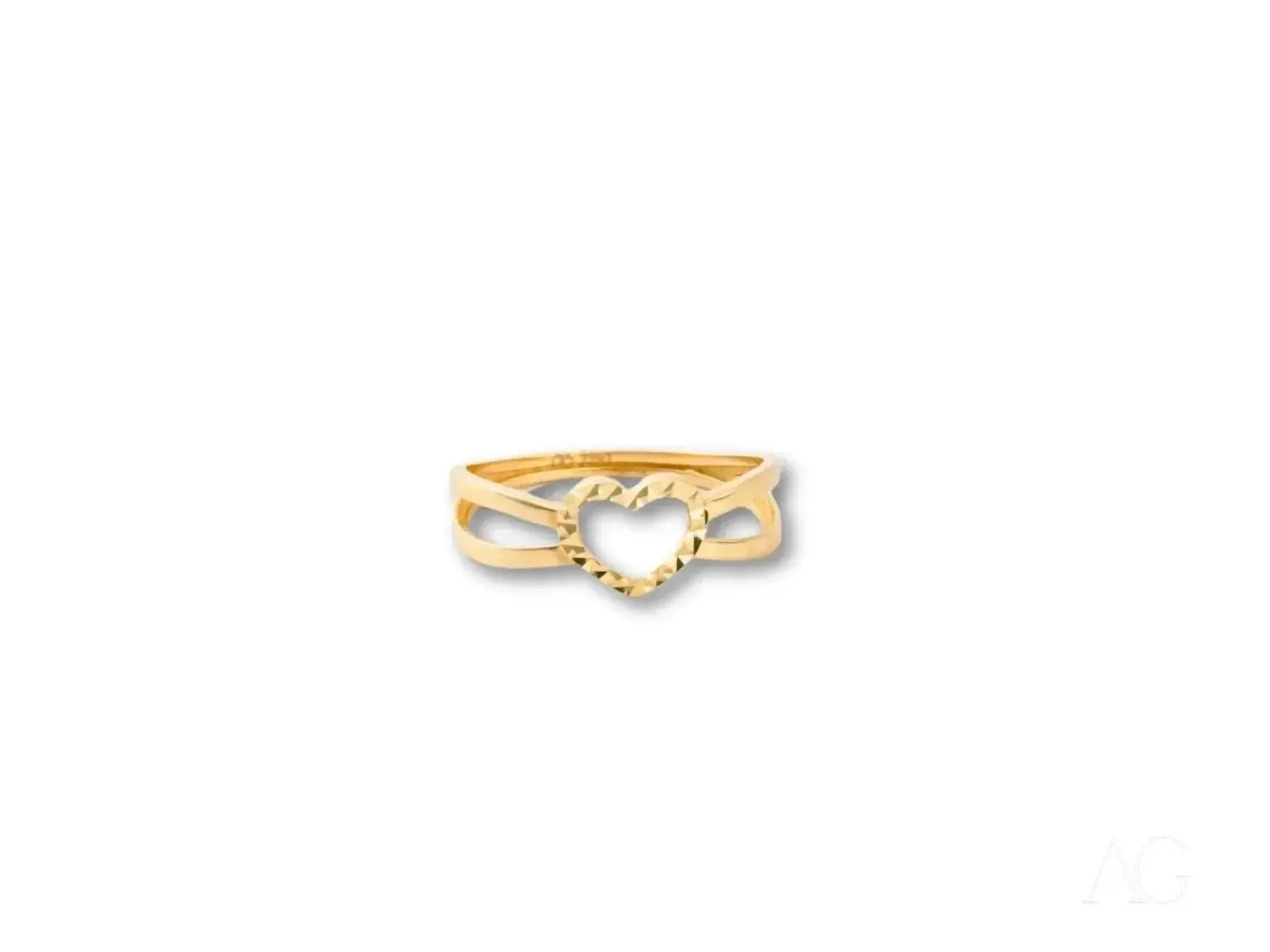 A gold engagement ring with a diamond centerpiece and matching band in a white envelope from Art Gold jewelry.