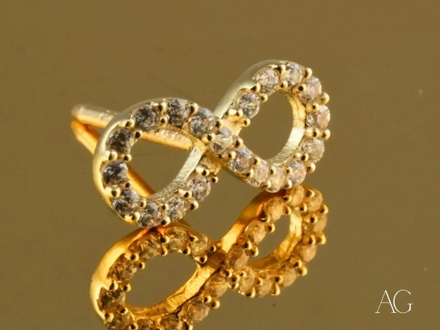 Silver filigree peacock brooch with turquoise, gold birds, and pearls complements engagement rings at Everett jewelry store.