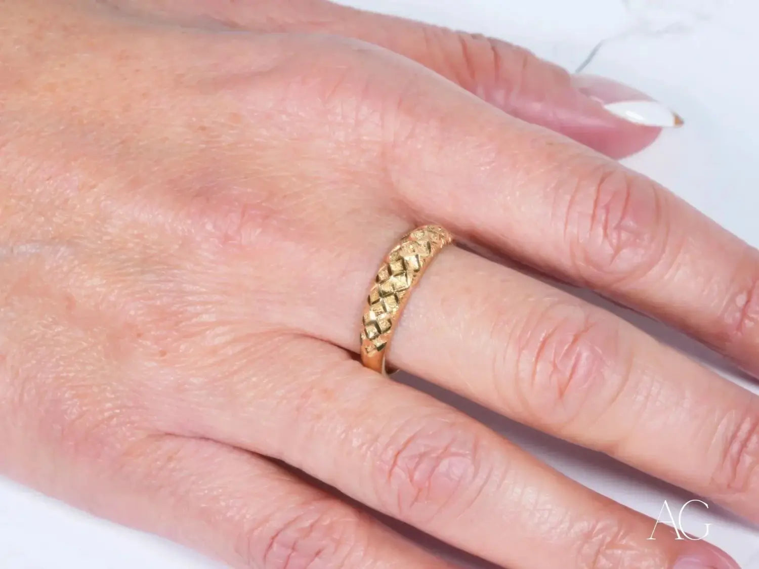 Three elegant platinum engagement rings with square-cut diamonds showcased at an Everett jewelry store.