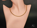 Gold Round Spiga Chain necklace with 18k yellow gold lobster clasp on mannequin