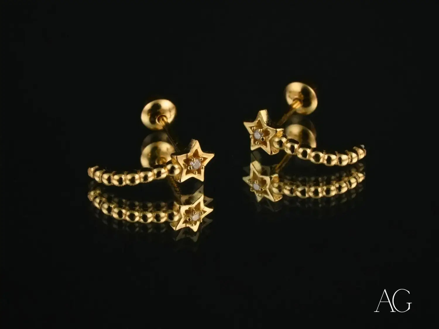 Stunning 18k gold star hoop earrings with Graff Diamonds accent