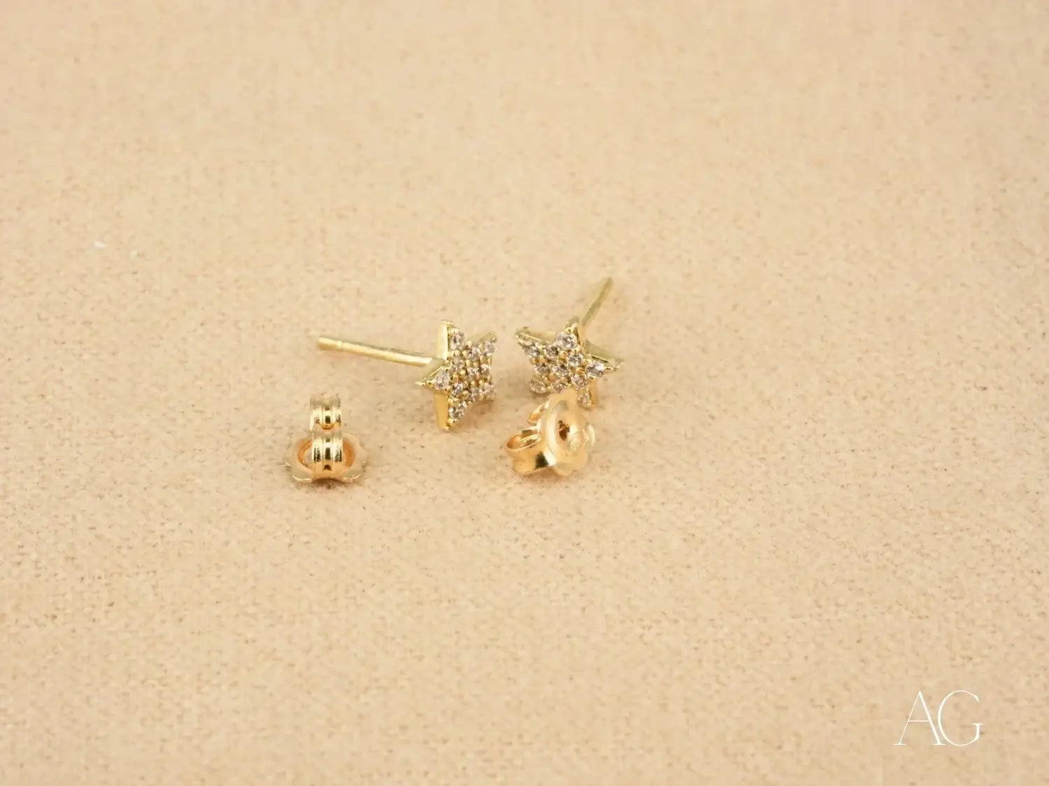 gold star stud earrings with sparkling clear crystals made from art gold, exemplifying fine jewelry in gold jewelry collections.