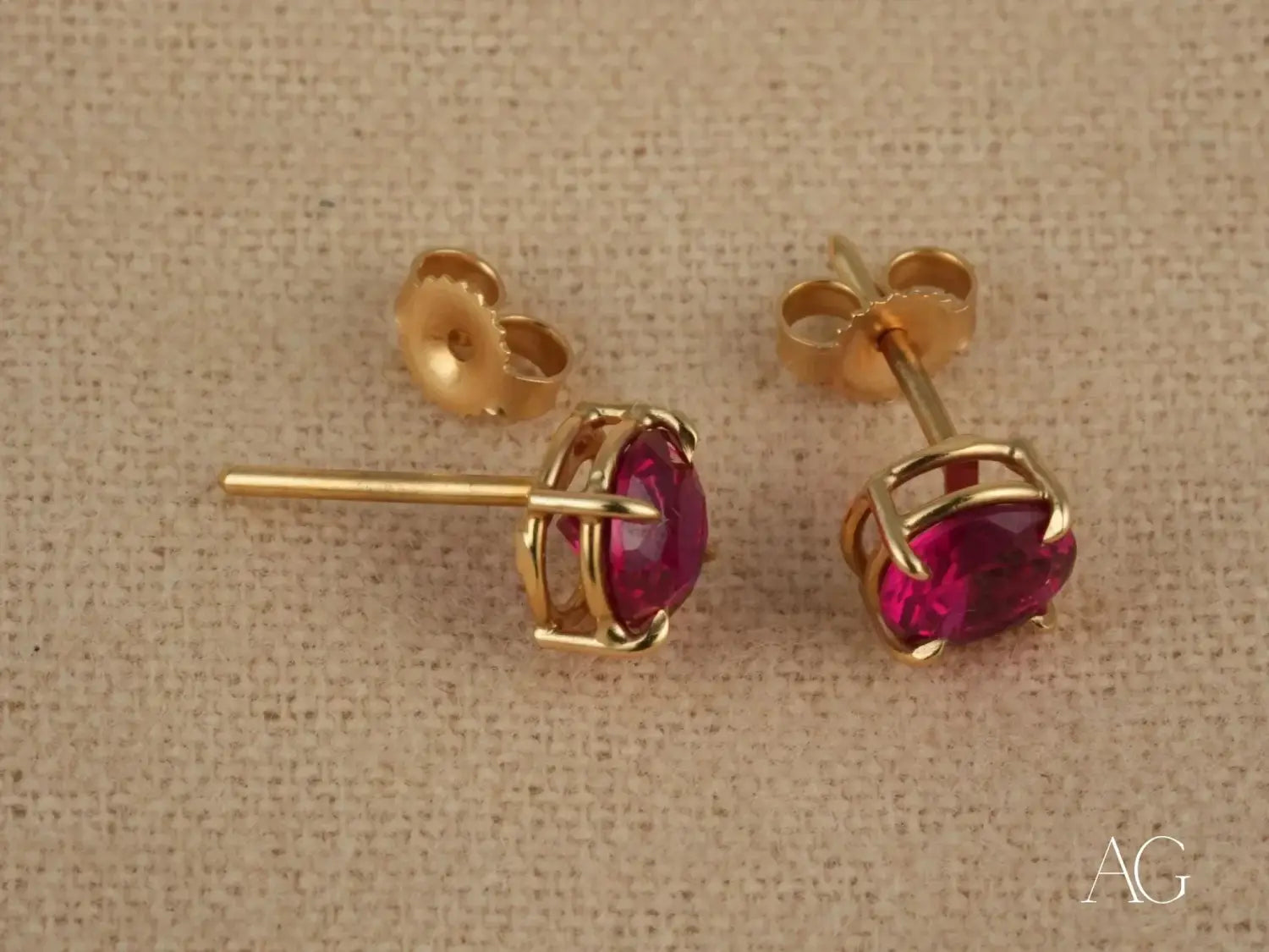 Art gold jewelry: oval ruby gold stud earrings in prong design