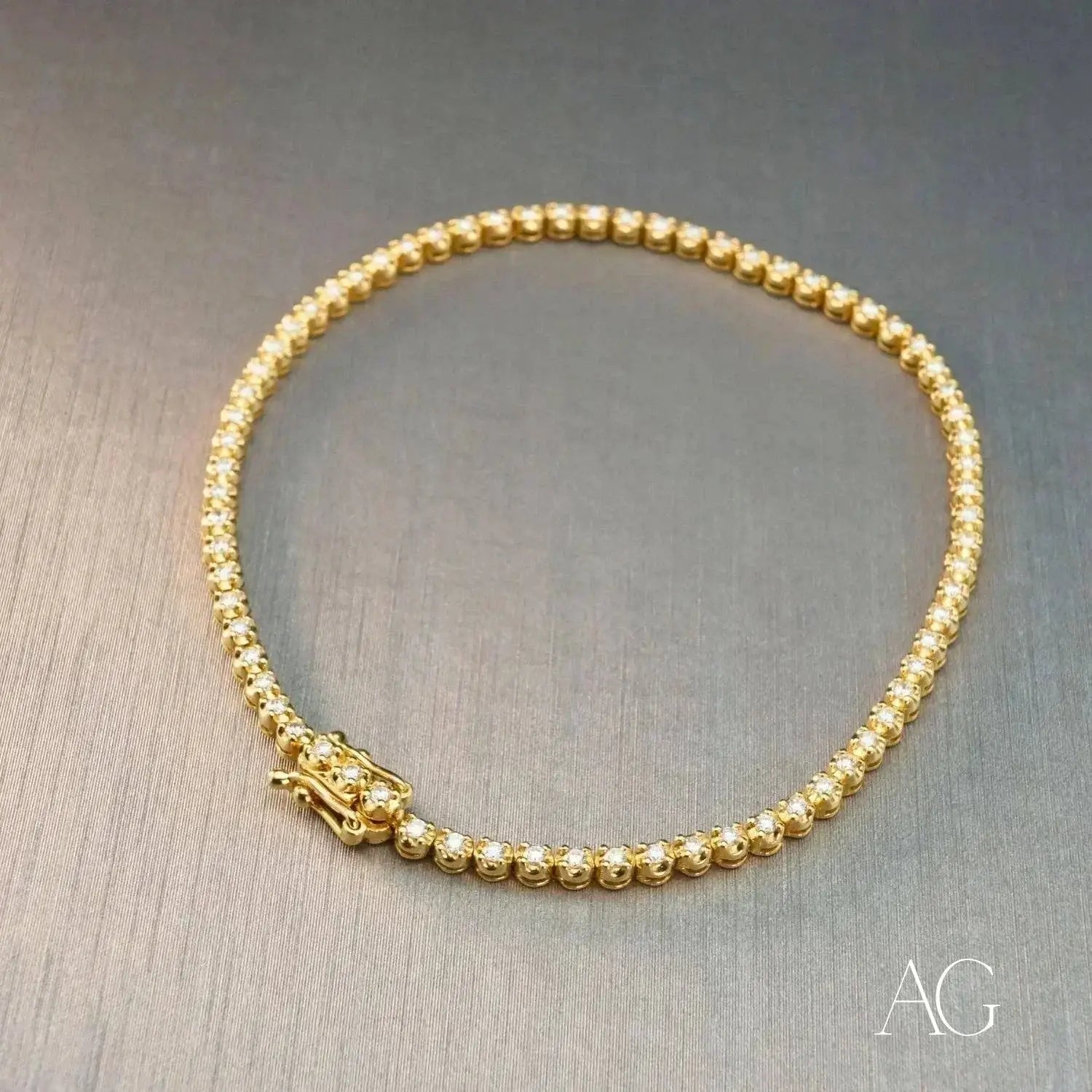 Crown jewels gold tennis bracelet with diamond dragon clasp