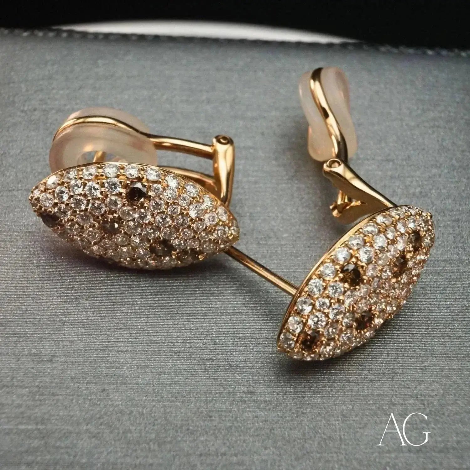 gold-toned bangle with sleek intertwined design and sparkling clear stones exemplifies fine gold jewelry trends.