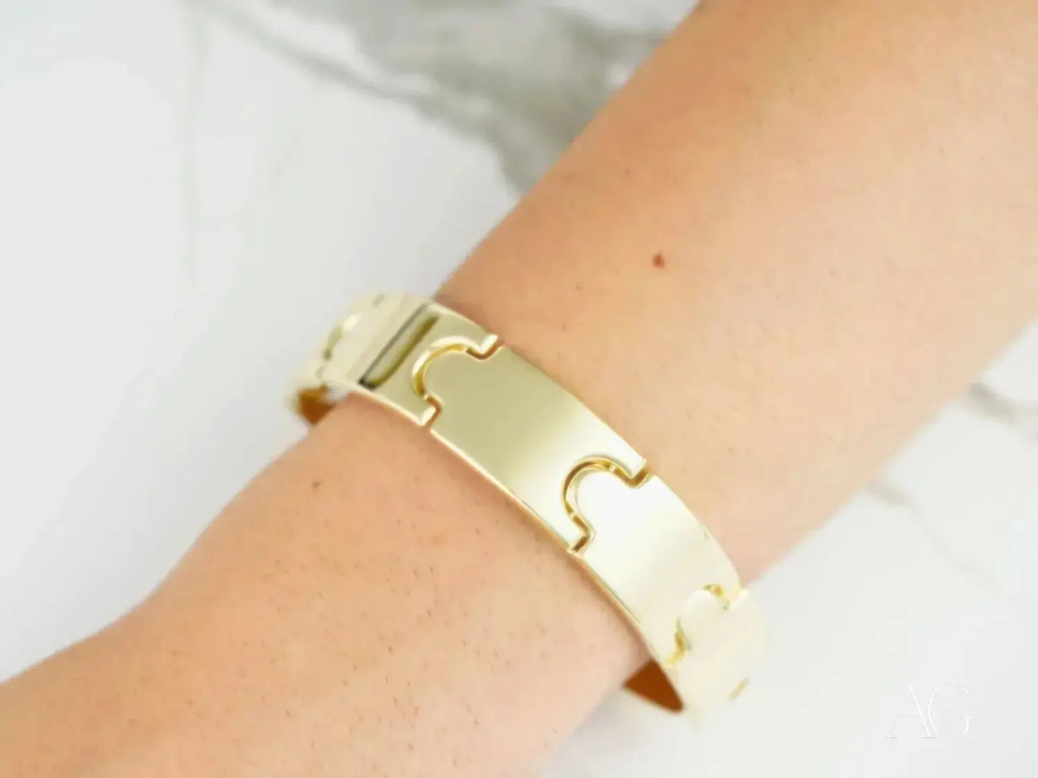 silver charm bracelet with dangling charms including small bell and heart pendant complements fine gold jewelry collections.