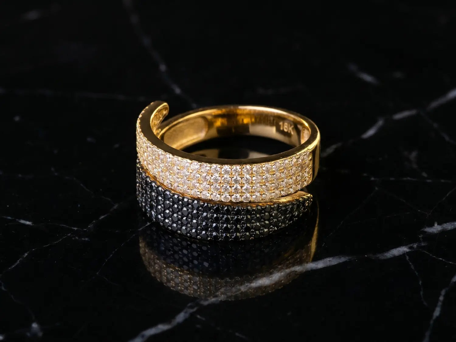 A sparkling diamond ring with clear stones set in a sleek silver band for 18k gold jewelry care tips.