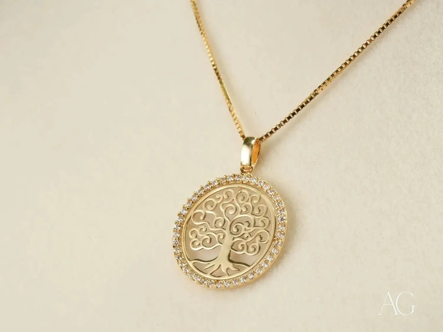 Gold Tree of Life pendant in luxury jewelry with crystal halo