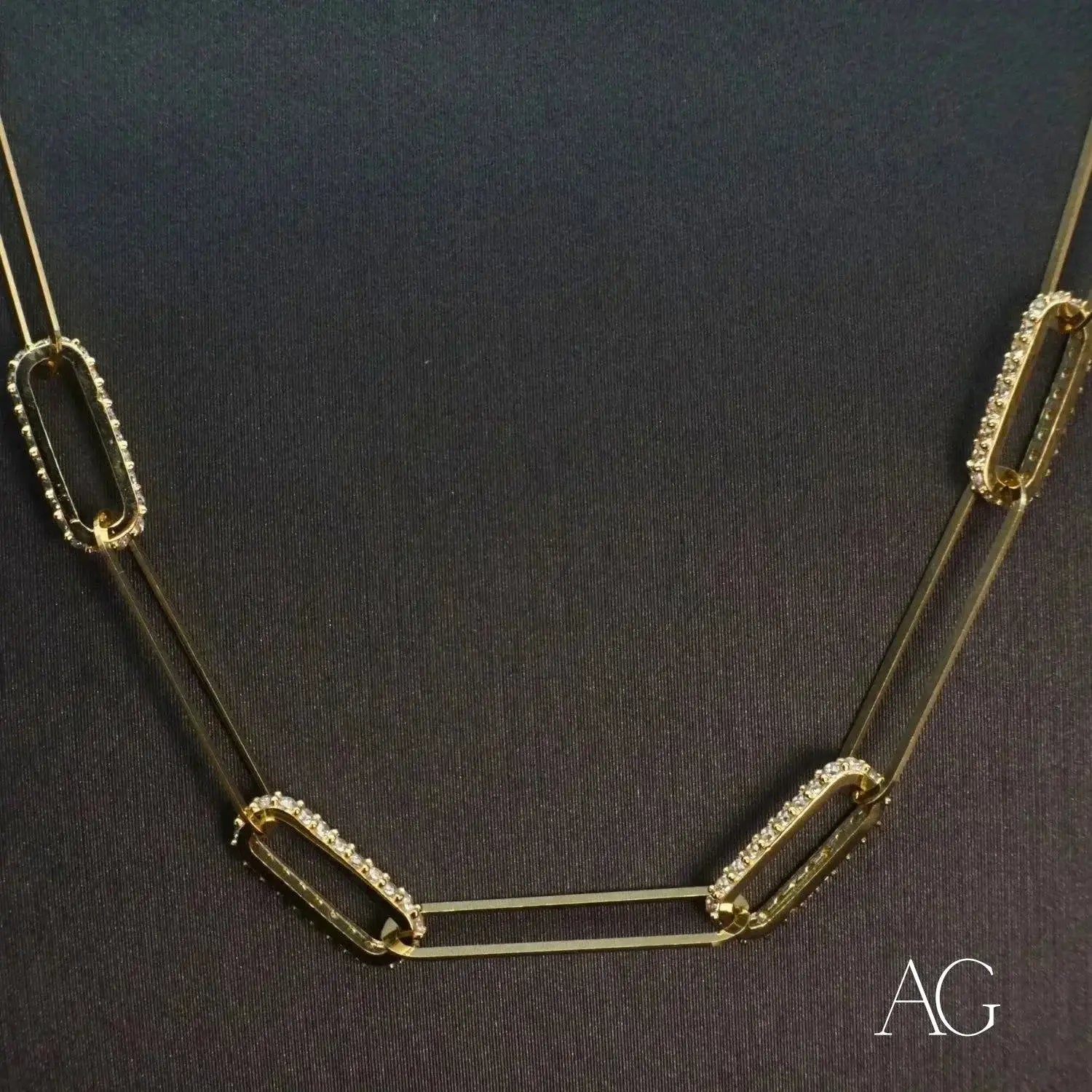 Gold-toned paperclip necklace with rhinestones in art gold jewelry history