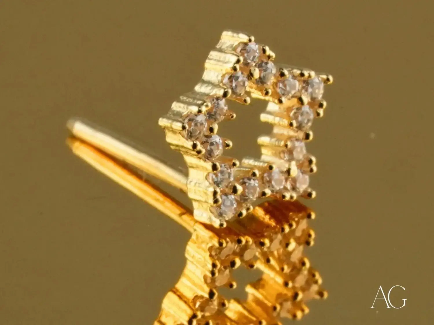 Stunning 18k gold art deco star stud earring with cubic zirconia