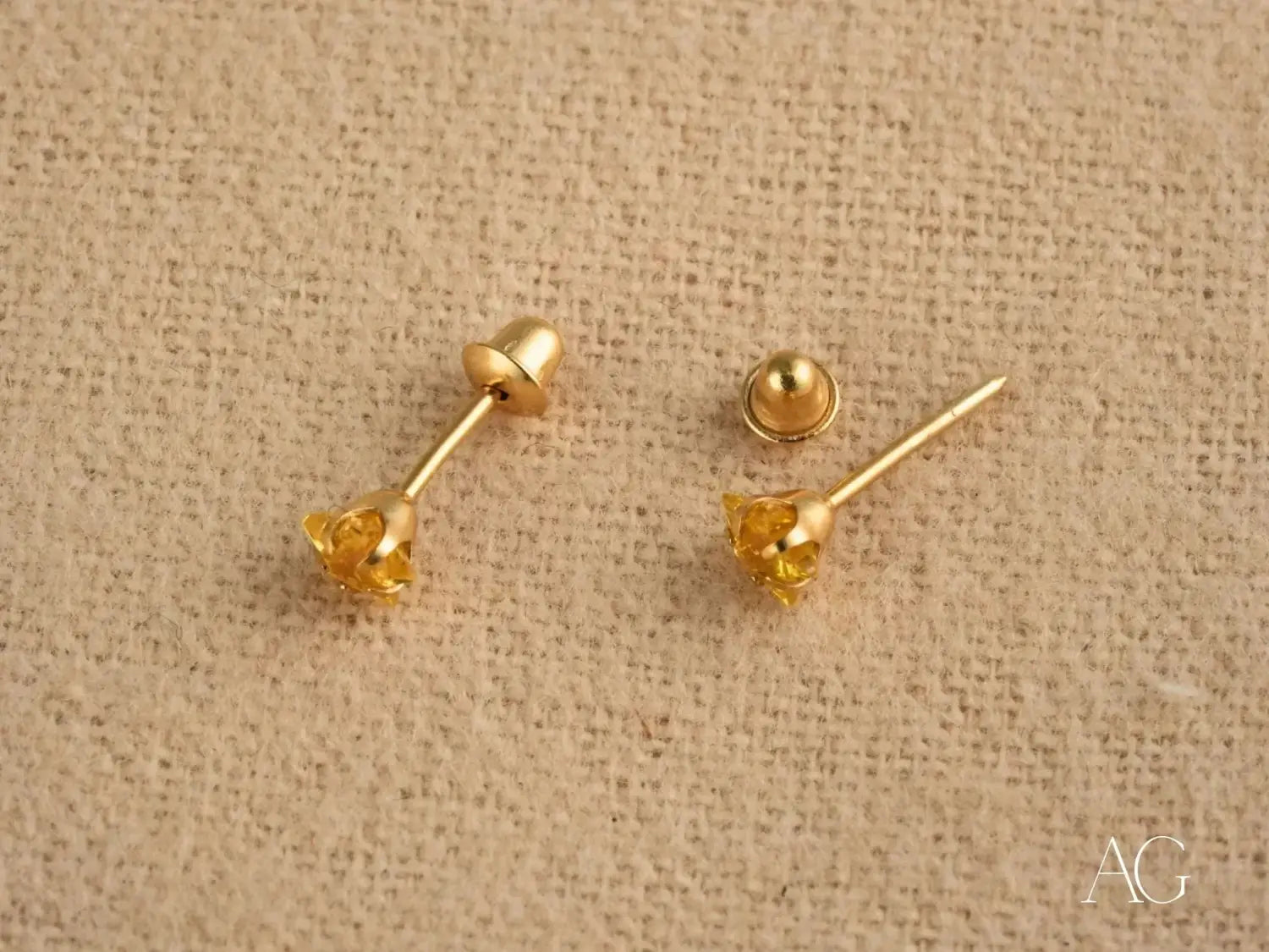 Ethical 18k gold jewelry: faceted yellow gem floral stud earrings