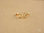 Gold-colored heart-shaped stud earrings with beaded design, perfect as 18k gold heart jewelry