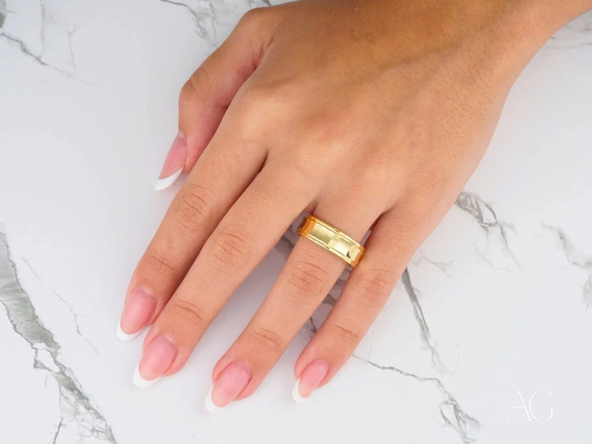Golden Cascade wedding band ring in art gold jewelry on finger