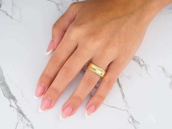 Golden Cascade wedding band ring in art gold jewelry on finger