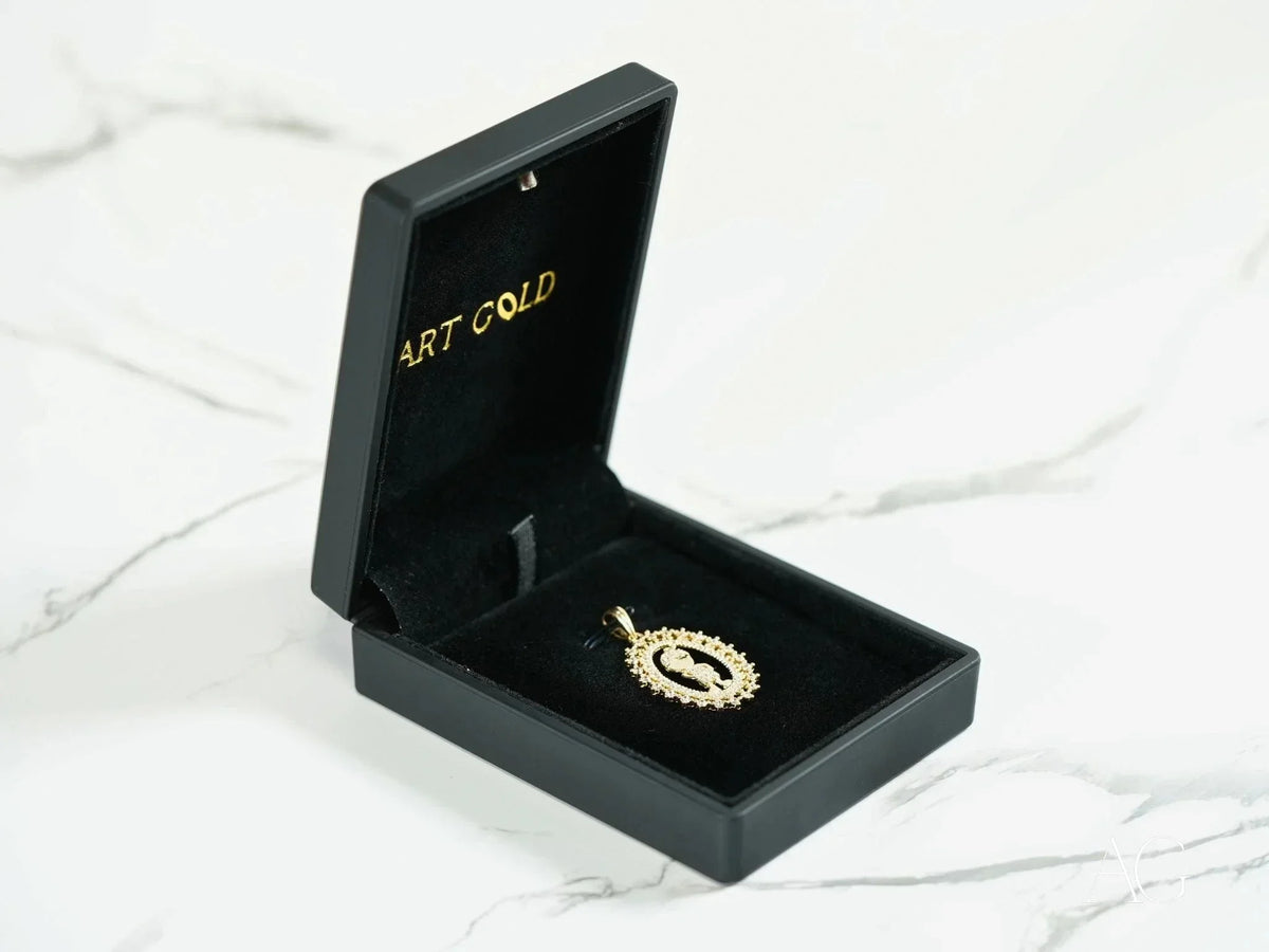 Golden Charm 18k gold CZ boy pendant in open black velvet box