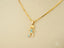Art gold jewelry 18k solid gold golden charm featuring boy-shaped pendant with light blue gemstones playing soccer