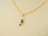 18k solid gold charm pendant of boy playing soccer with blue CZ gems