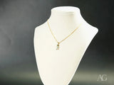 Golden Charm 18k solid gold necklace with boy pendant and clear stones