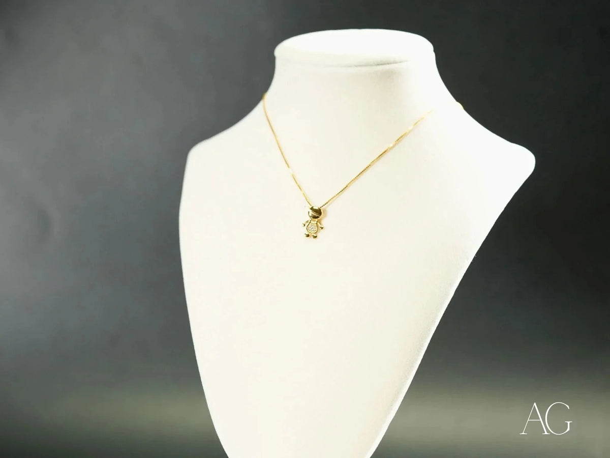 Golden charm doll pendant with sparkly teddy bear in art gold jewelry