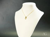 Golden charm doll pendant with sparkly teddy bear in art gold jewelry