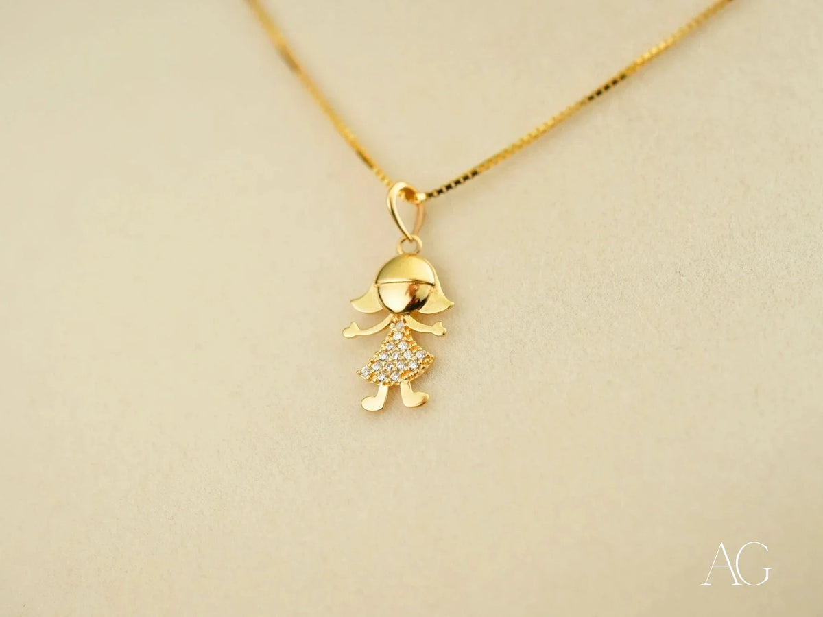 Golden charm doll pendant in art gold jewelry with diamond dress