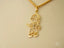 Golden Cherish Pendant featuring a boy in cap and shorts with clear stones in 18k solid gold