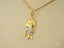 Golden doll pendant in 18k solid gold with sparkling stones, part of art gold jewelry collection