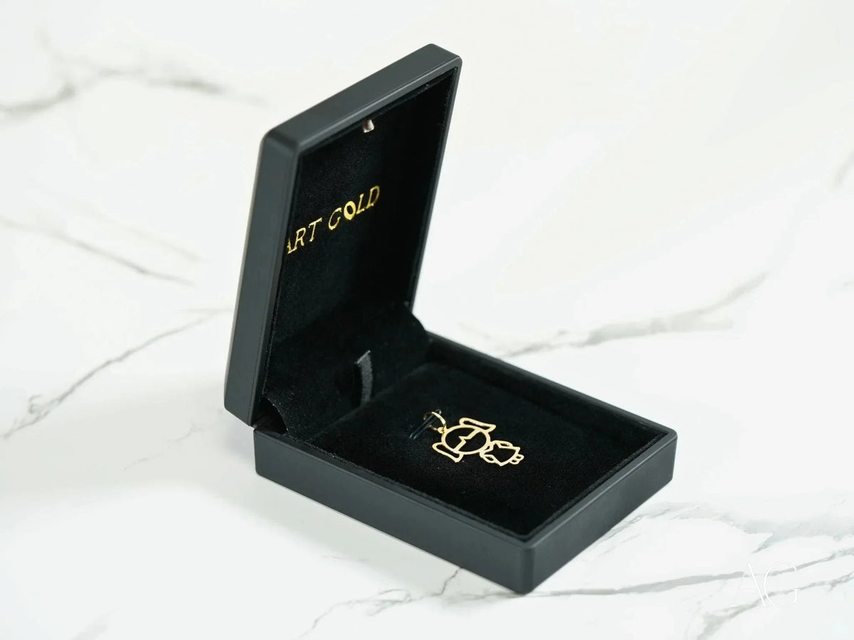 Opened 18k yellow gold doll girl pendant in black jewelry box