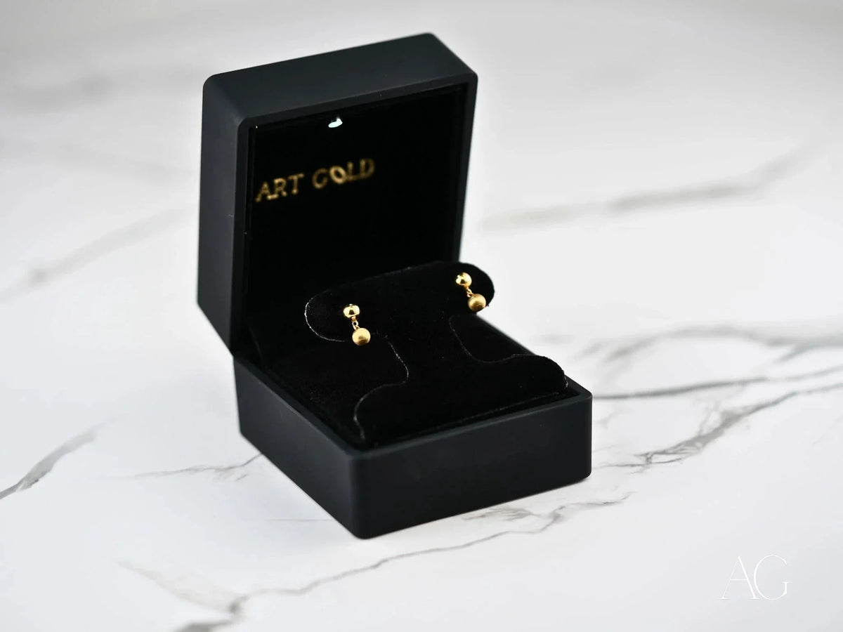 Golden Duo 18k gold ball drop earrings in black velvet box