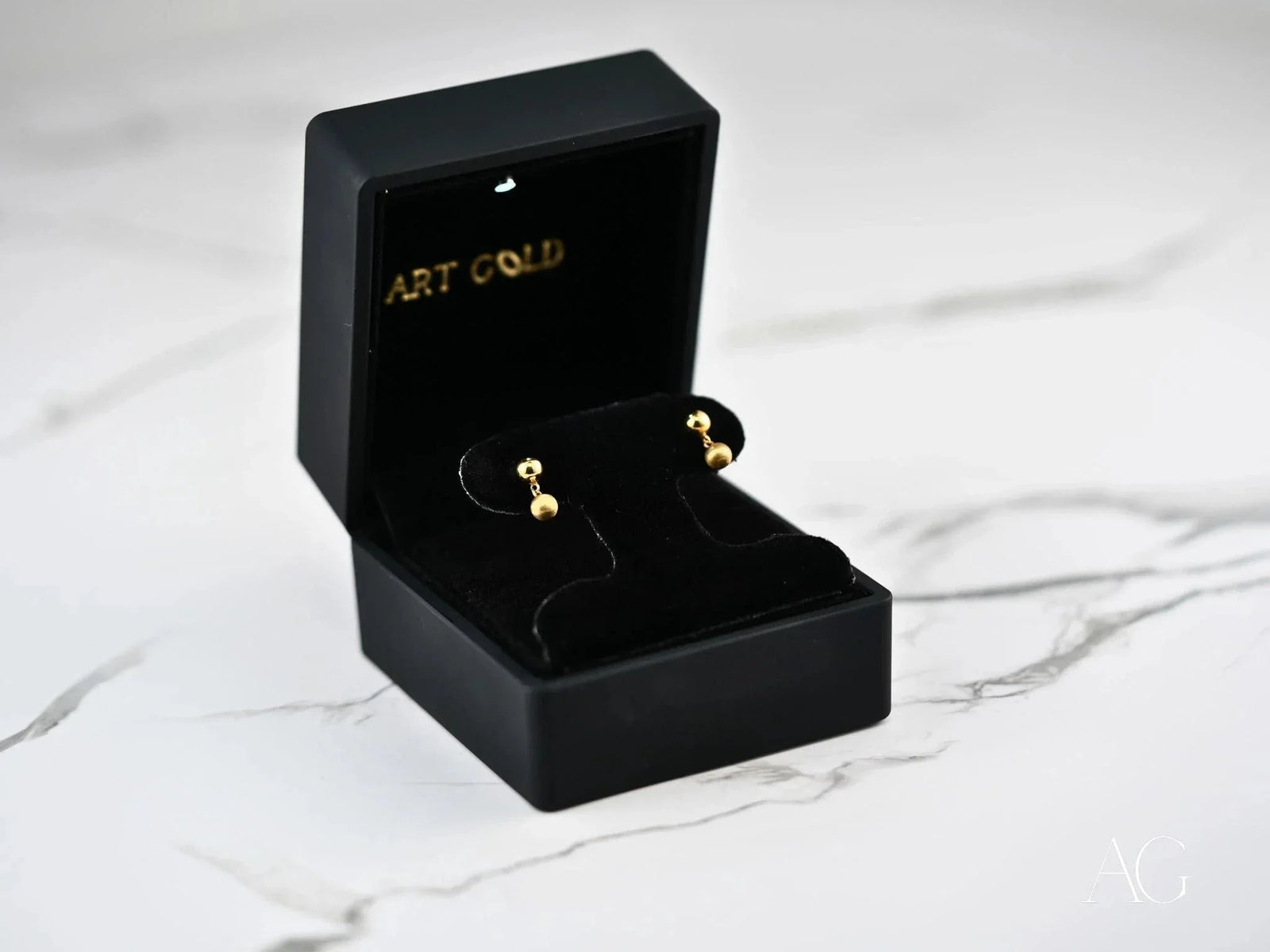 Golden Duo 18k gold ball drop earrings in black velvet box