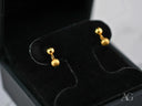 Pair of brushed gold drop earrings in 18k gold ball design, in jewelry box
